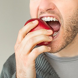 person eating apple 