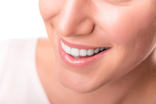 closeup of young woman smiling 